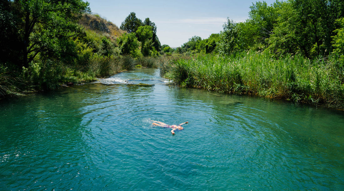Person floating on a lake