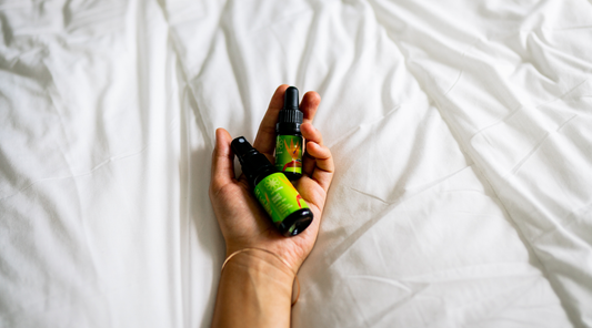 quiet mind mist and anointing oil on a comfy bed