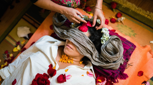 A person receiving a botanical treatment.