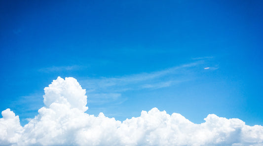 A blue sky with a cloud